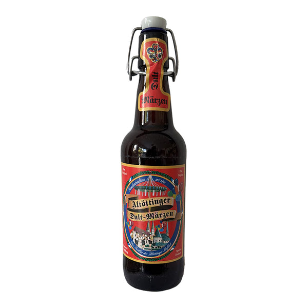 A bottle of Altottinger Dult Marzen beer with a swing-top closure, featuring a red and blue label with a circus theme, set against a plain white background.
