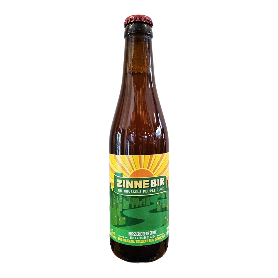 Brown beer bottle with a green label on a white background