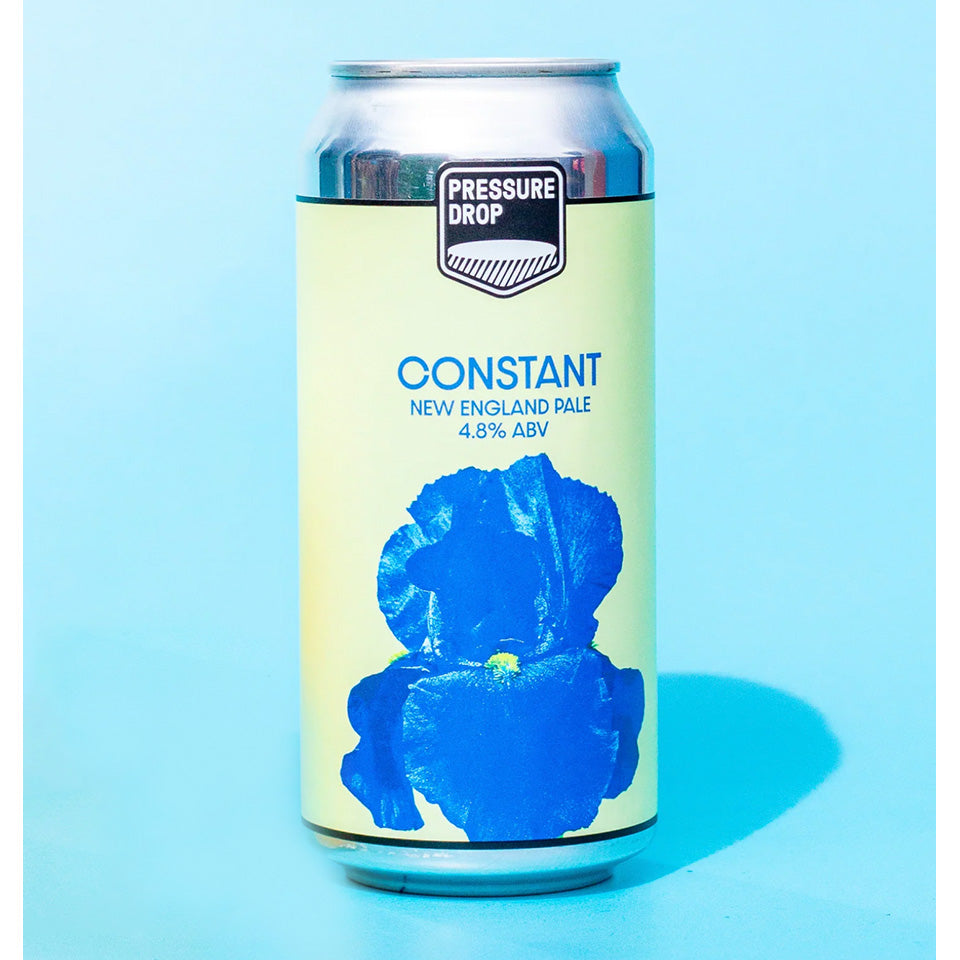 Beer can with 'Pressure Drop' branding and blue flower graphic on a light blue background