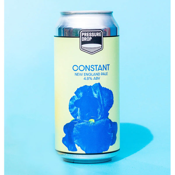 Beer can with 'Pressure Drop' branding and blue flower graphic on a light blue background