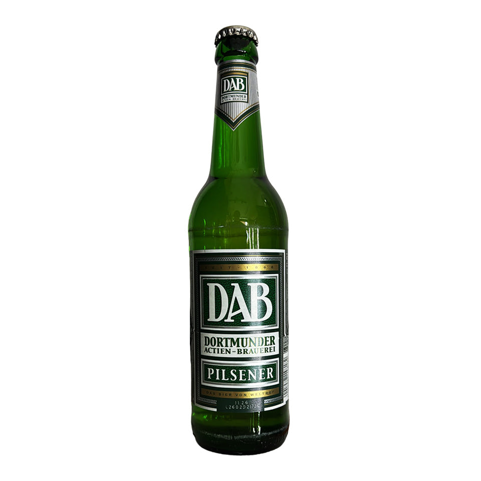 A green glass bottle of DAB Dortmunder Pilsener beer on a plain white background.