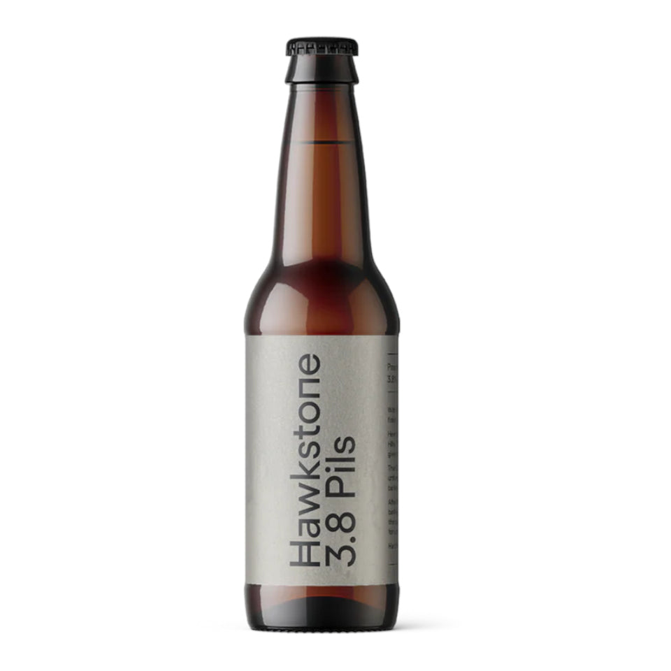Brown beer bottle with a label on a white background