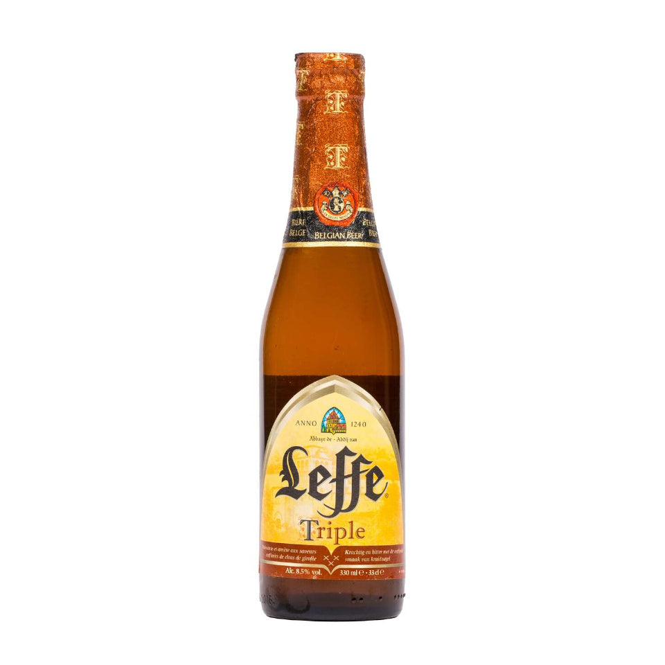 Leffe Triple beer bottle on a white background