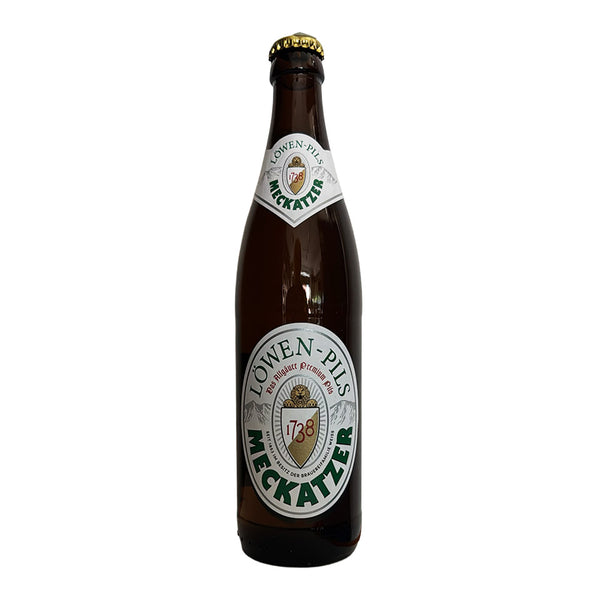 A brown glass bottle of Towen-Pils Meckatzer beer with a white and green label and a gold crown cap, isolated on a white background.