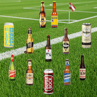Various beer bottles and cans on a grass field background