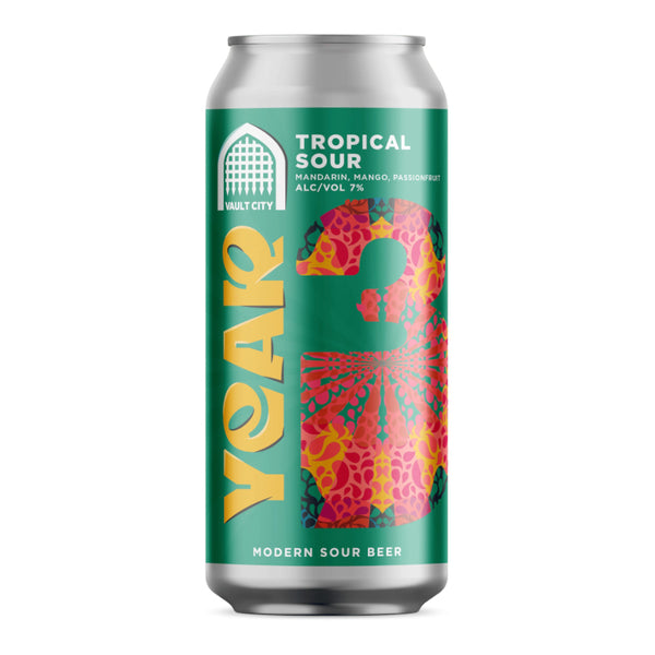 A single aluminum can of malt city tropical sour beer on a plain white background. The can features a bright green label with large yellow 'year' lettering, a colorful floral pattern, and white text reading 'TROPICAL SOUR' and 'VAULT CITY'.