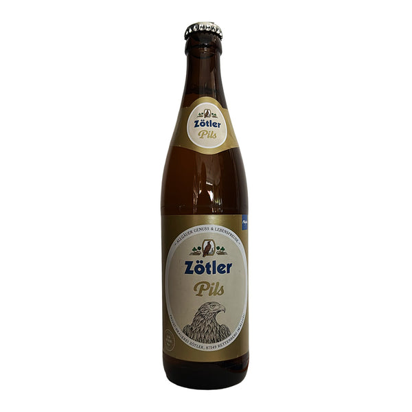 A single bottle of Zötler Pils beer in a dark brown glass bottle with a cream and gold label, shown against a plain white background.